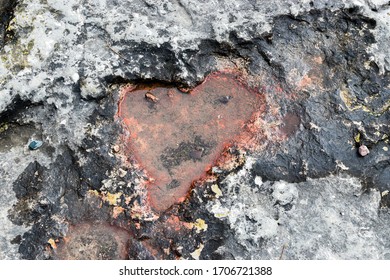 Heart Shaped Impression With Water And Red Algae Found In A Large Rock Near Lake Erie