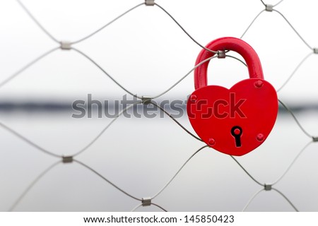 Heart shaped love padlock - beautiful wedding day custom. Shallow depth of field