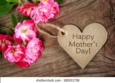 Heart Shaped Mothers Day Card With Roses On Wood Background