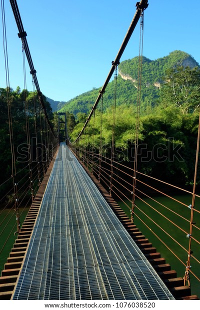 Heart\
shaped mountain with iron rope bridge in\
Thailand