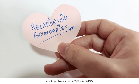 A heart shaped note with the words Relationship Boundaries