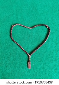 Heart Shaped Prayer Beads On Green Plinth