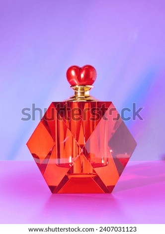 A Heart Heart Shaped Red Bottle on a Pastel Background