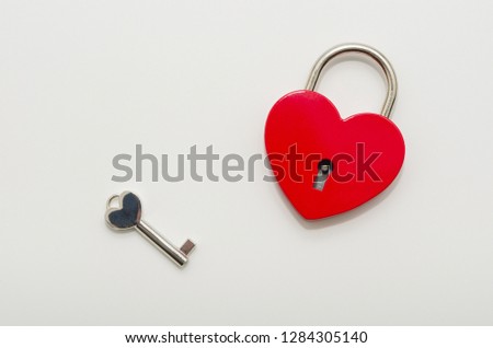 Heart shaped red lock with key. Concept of love forever with padlock 