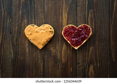 Heart shaped sandwiches with peanut butter and jelly on wooden background - Powered by Shutterstock