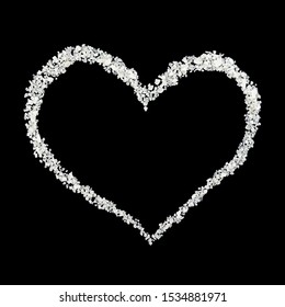 
heart shaped sea salt on black background 