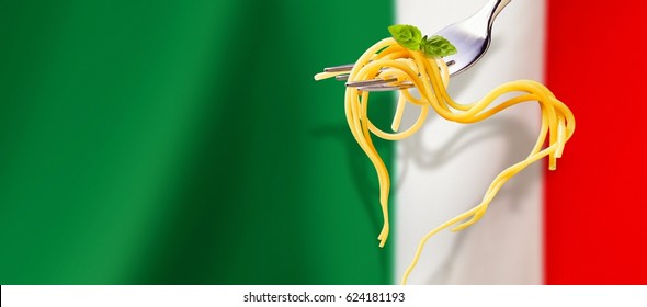 Heart shaped spaghetti hanging on a fork over the red, white and green Italian flag in panoramic banner format with copy space