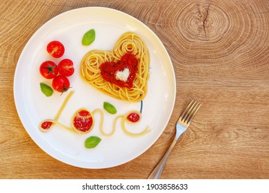 Heart shaped spaghetti,tomato sauce,parmesan cheeses,cherry tomatoes,Italian basil and 