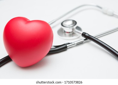 Heart Shaped Squeeze Ball For Hand Muscle Exercise And Stethoscope On White Background And Copy Space