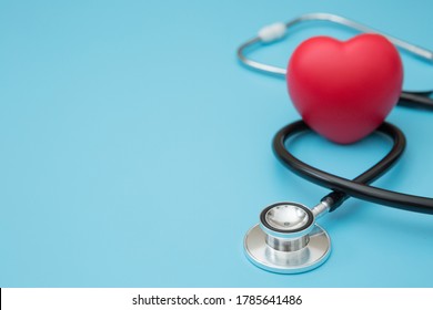 Heart Shaped Squeeze Ball For Hand Muscle Exercise And Stethoscope On White Background And Copy Space