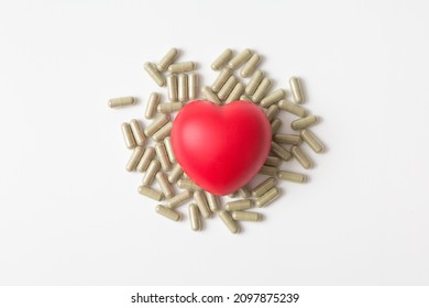 Heart Shaped Squeeze Ball And Pill Capsule On White Background And Copy Space For Health Care Concept