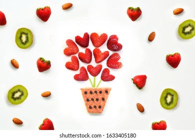 Heart Shaped Strawberry Bouquet With Kiwi And Almond Fruit Arrangement On A White Background