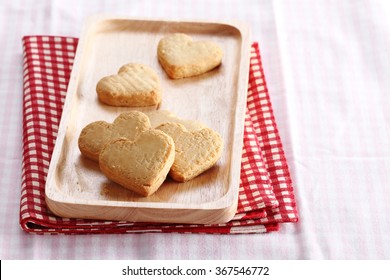 Heart Shaped Sugar Cookies On Wooden Plate
