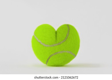 Heart shaped tennis ball - Concept of love and game - Powered by Shutterstock