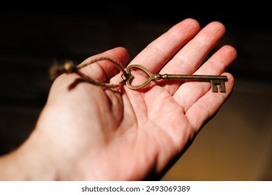 Heart Shaped Vintage Skeleton Key in Hand - Powered by Shutterstock