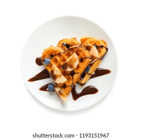 Heart Shaped Waffles With Banana, Blueberries And Chocolate Sauce On White Background