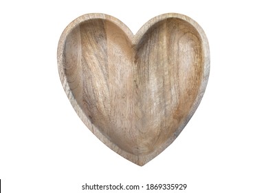 Heart shaped wooden plate isolated on white background.