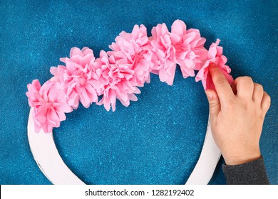 Heart Shaped Wreath Decorated Artificial Flower Made Pink Tissue Paper Napkins. Gift Ideas For Valentines Day, Decor For Day Love, Concept February 14. Step By Step. Process Children Crafts. Top View