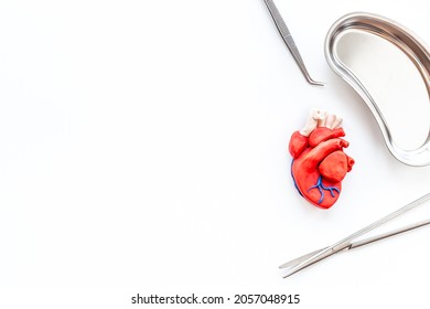 Heart Surgery Concept With Surgical Instruments And Heart Model Made Of Plastiline