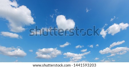 heart symbol shape cloud over blue panoramic sky. love theme background. high resolution