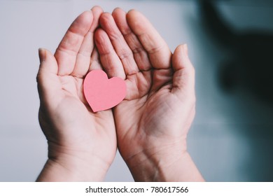 heart in woman hands, be loving and generous, background for valentines day, loving hands, charity is important