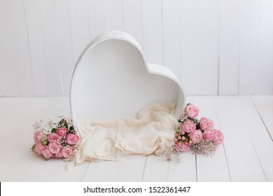 heart of wood decorated with roses. basket for newborn photo shoot. pink rose. heart