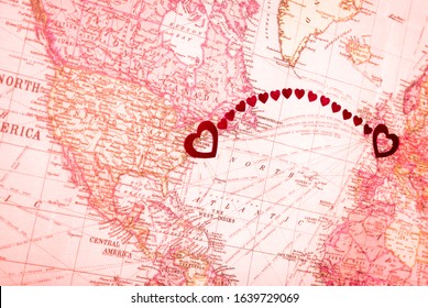 Hearts Connecting New York, USA To London, UK Make An Arch From America To Europe On An Old Map