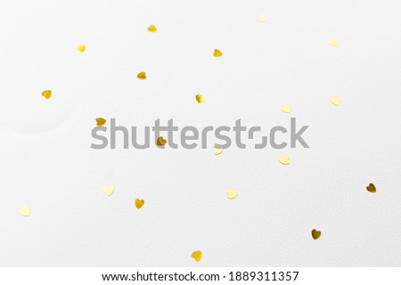 hearts made of golden glitter and stars on a pink background. Valentines day, love concept.Gold hearts texture. Golden valentine day background.