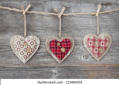 Hearts over a wooden background - Powered by Shutterstock