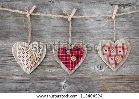 Hearts over a wooden background