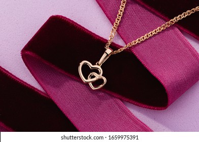 Hearts Shape Rose Gold Pendant Necklace On Pink Background. Romantic  Jewelry. Advertising Still Life Product Concept For Valentines Day