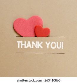 Hearts with thank you sign. Two red hearts with thank you sign on paper background
