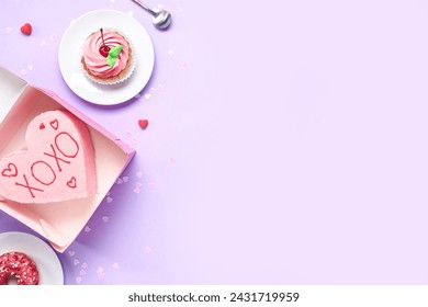 Heart-shaped bento cake with donut and cupcake on purple background. Valentine's Day celebration - Powered by Shutterstock