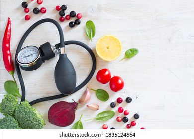 Heart-shaped Blood Pressure Monitor And Vegetables With Fruits To Prevent Hypertension, Healthy Diet Concept