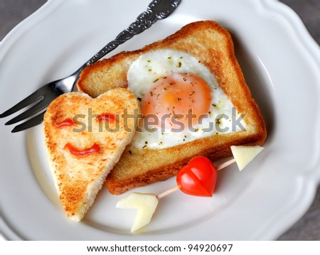 Heart-shaped fried egg and toast