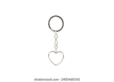 Heart-shaped keychain with key ring isolated on white background. Concepts for real estate and moving home or renting property. Buying a property. Mock-up keychain.Copy space.