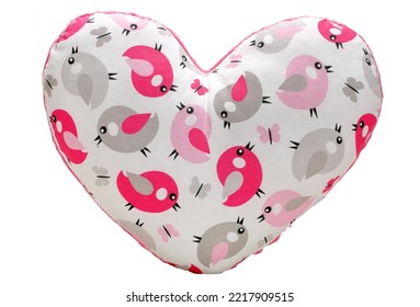 Heart-shaped pillow fabric with a pattern of birds isolated on a white background - Shutterstock ID 2217909515
