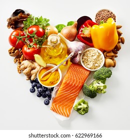 Heart-shaped Still Life Of Healthy Food For The Heart And Cardiovascular System With Fresh Ingredients Rich In Antioxidants And Omega-3 Fatty Acids Viewed From Above Isolated On White