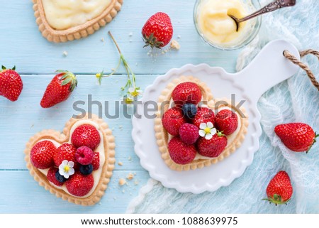 Similar – Image, Stock Photo Delicious strawberry tartlets with vanilla cream in heart shape