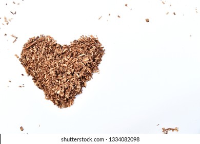 Heart-shaped Wood Saw Dust On Dirty White Background