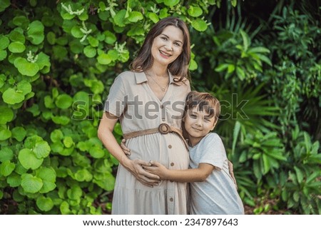 A heartwarming moment captured in the park as a pregnant woman after 40 shares a special bond with her teenage son, embracing the beauty of mother-daughter connection