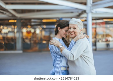 Heartwarming moment of a grandmother and granddaughter sharing an affectionate embrace outside, showcasing their close bond and happiness. - Powered by Shutterstock