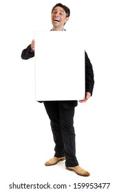 Hearty Salesman With A Cheesy Wide Toothy Smile Standing Holding A Blank Rectangular Sign Board In Front Of His Chest As He Seeks To Promote His Product, Blank Copyspace On The Placard For Your Text