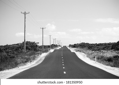 Heat haze rises and the road gets a little bumpy in black and white