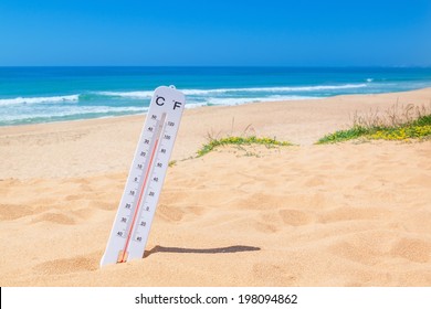 The heat on the beach. Thermometer for temperature weather.