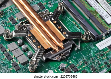 heat sink or heat pipe or computer processor cooler or radiator on notebook computer motherboard made from copper. - Shutterstock ID 2203738483