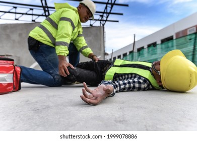 Heat Stroke Or Heat Exhaustion In Body While Outdoor Work. Accident At Work Of Builder Worker At Construction Site. Selection Focus On Hand Of Worker, Lifesaving, Rescue, First Aid Basic Concept.