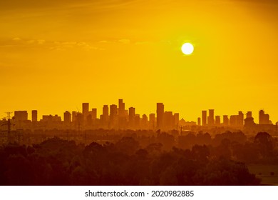 Heat wave over a city skyline - Shutterstock ID 2020982885