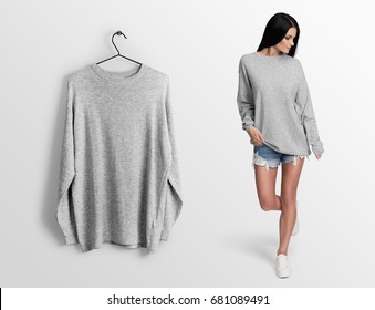 Heather Grey Pullover, Long Sleeve T-shirt On A Young Woman In Shorts, Isolated,mockup. Pullover, Hoodie Mockup On Hanger, Hanging Against Empty Wall Background.