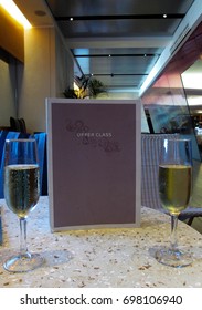 Heathrow Airport, London - August 2011: Glasses Of Champagne On A Table With A Menu In The Virgin Atlantic 